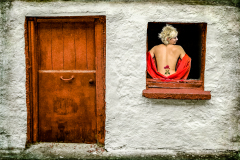 Woman In The Red Window