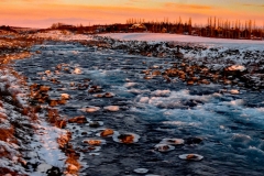 0318PRG0-General[Neena_Kumar]house-by-icy-river-at-dusk